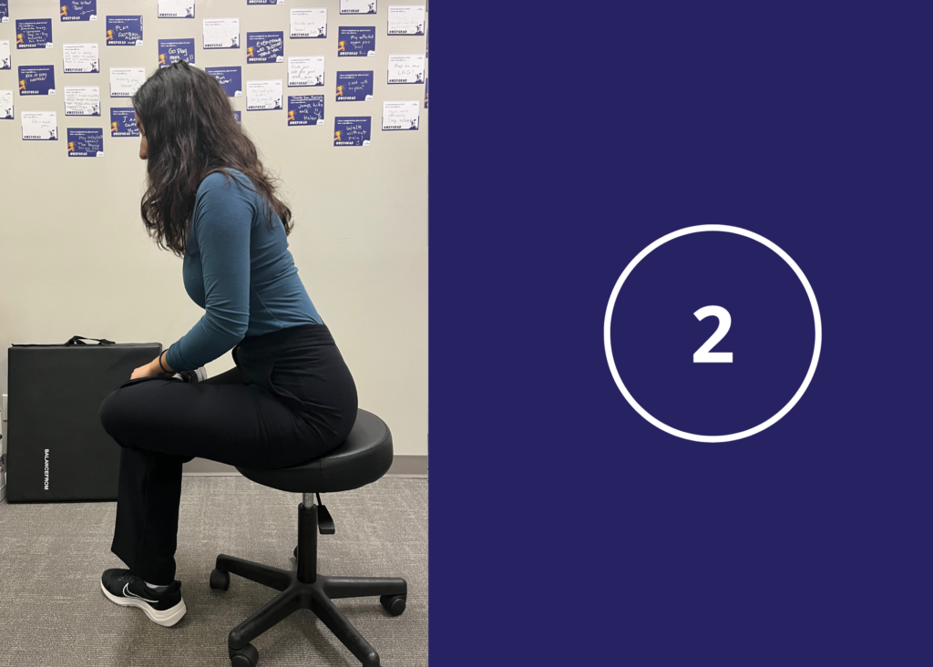 co-op student demonstrates Seated Glute Stretch figure 4 step 2