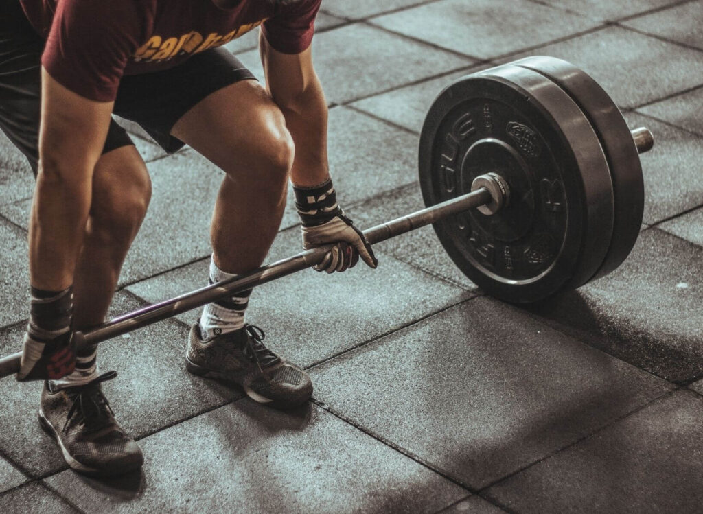 a person preparing to do a deadlift