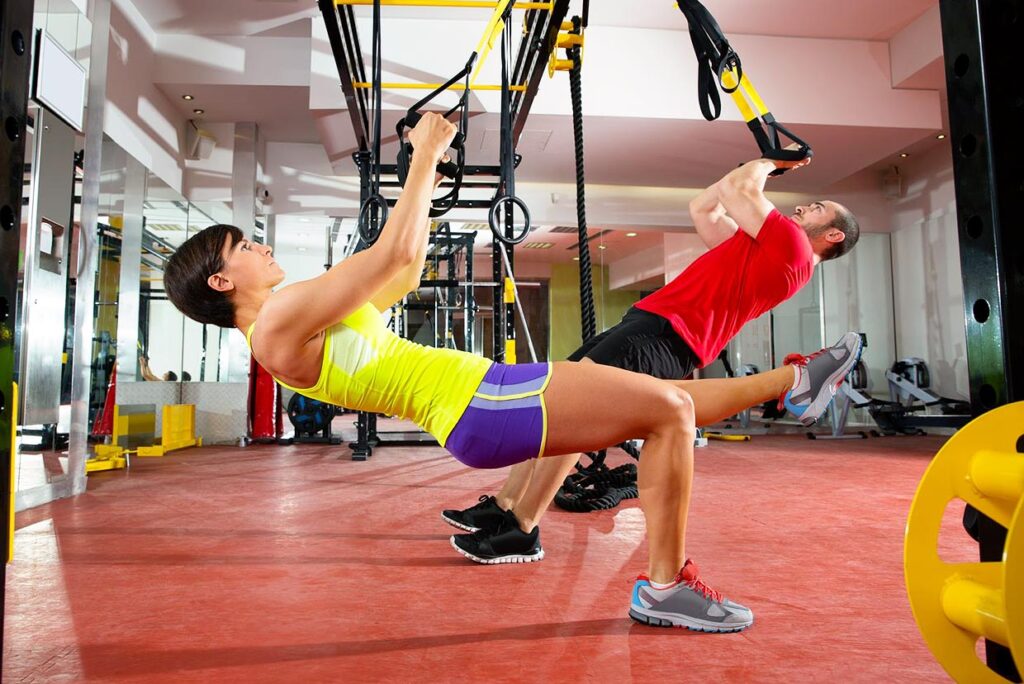 2 people working out together achieving muscle balance