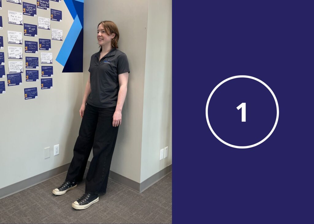 Step 1 of Wall Sit Exercise demonstrated by a co-op student