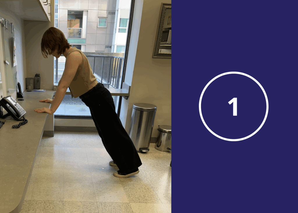 Step 1 of desk pushups demonstrated by a co-op student