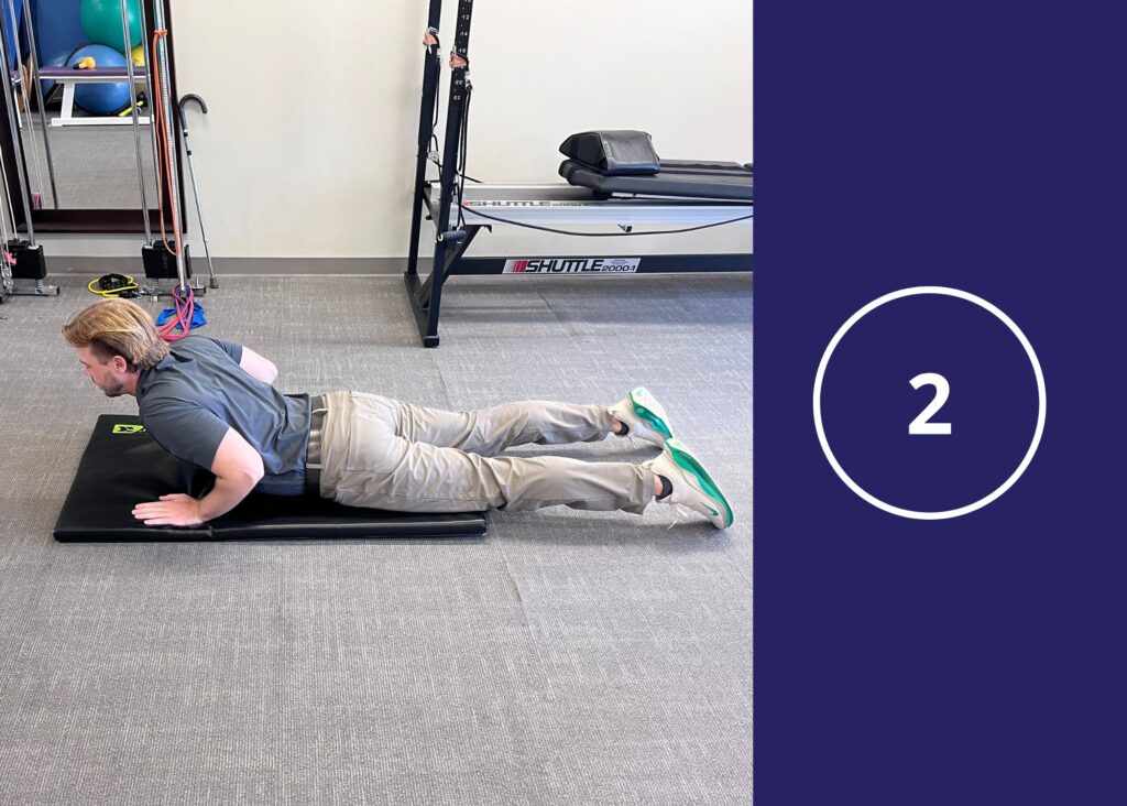 Step 2 of Prone Press-ups demonstrated by Chiropractor Dr. Donny