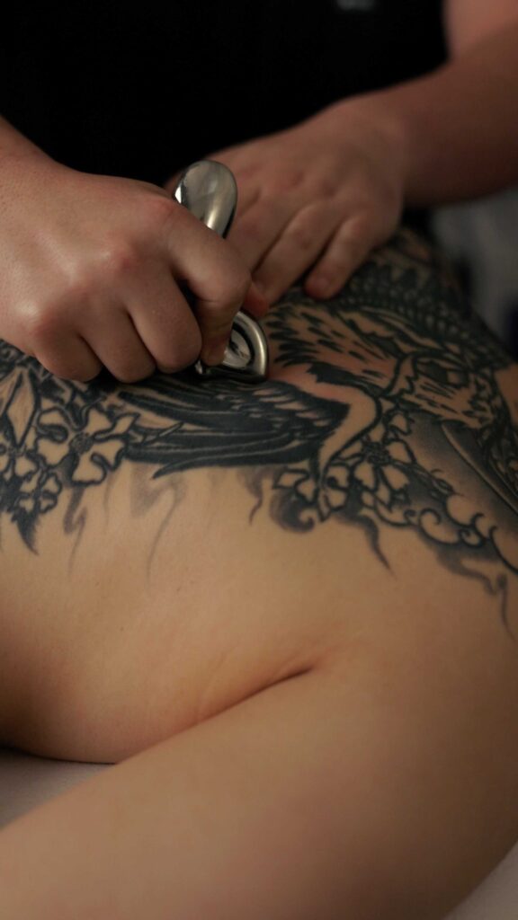 Jordan Martel Registered Massage Therapist treating a patient at West End Physiotherapy
