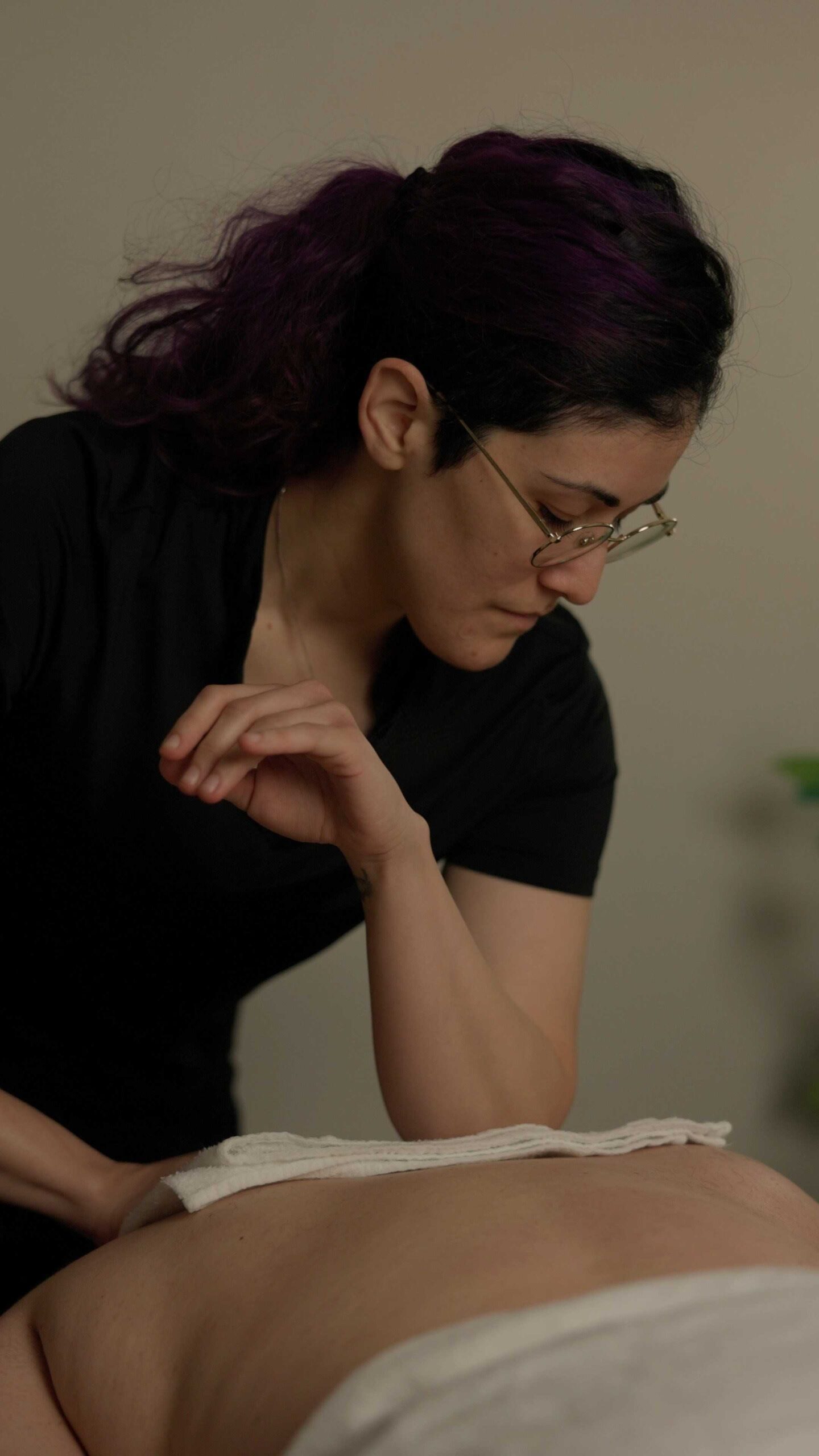 Lou Marquez Carrasquillo Registered Massage Therapist with a patient at West End Physiotherapy